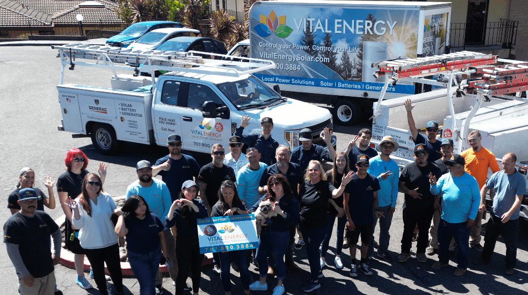 The Vital Energy team together in front of the company trucks